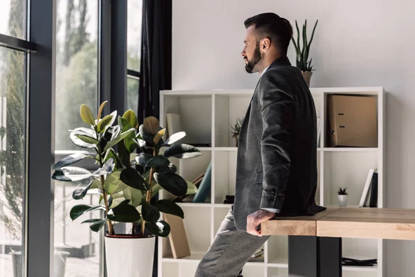 Businessman looking at window — Stock Photo, Image