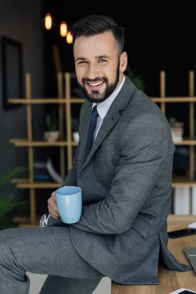 Businessman with cup of coffee — Stock Photo, Image