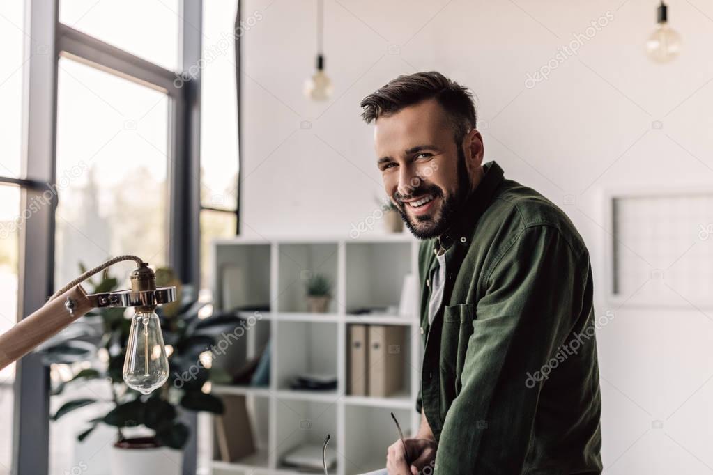 smiling bearded businessman