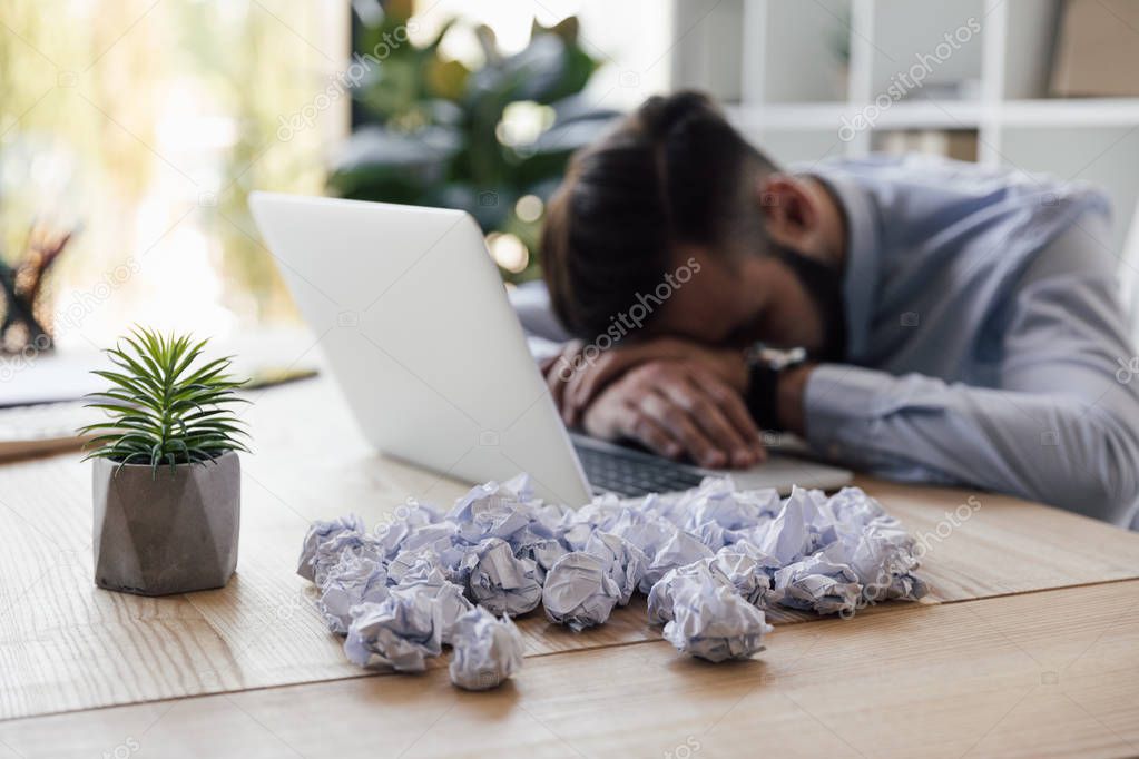 tired businessman at workplace