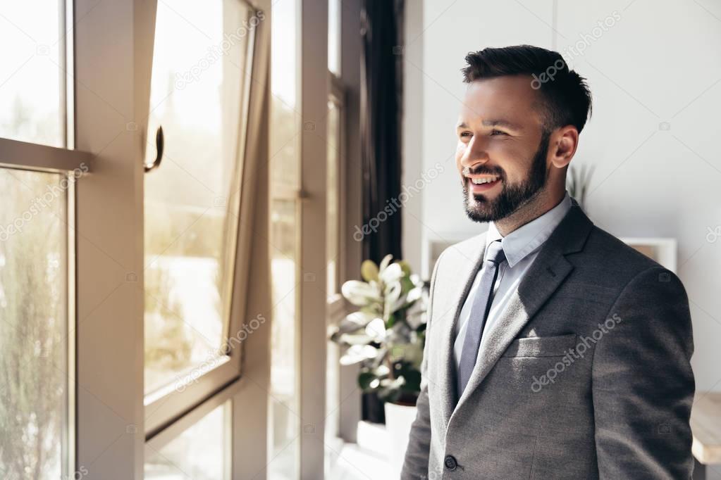 smiling businessman in formal wear