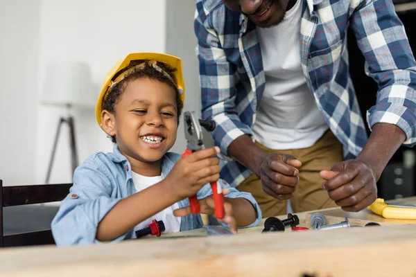 African-american father and son doing renovation — Stock Photo, Image