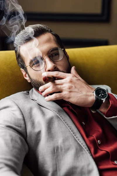 Handsome Bearded Man Smoking Cigar Couch — Stock Photo, Image