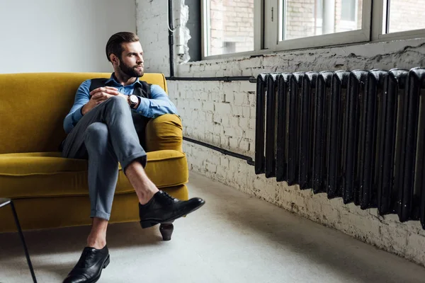 Elegant Man Sitting Yellow Sofa Looking Window — Stock Photo, Image