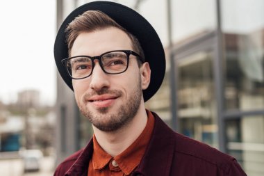 handsome fashionable man in eyeglasses and hat   clipart