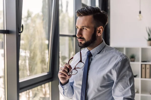 Businessman looking at window — Stock Photo
