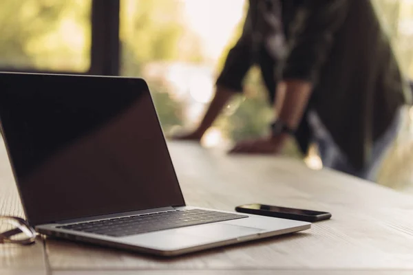 Opened laptop on table — Stock Photo