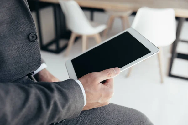 Businessman holding tablet — Stock Photo