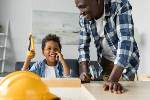 African-american father and son doing renovation — Stock Photo