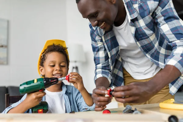 African-american father and son doing renovation — Stock Photo