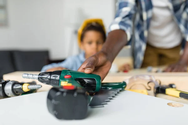 African-american father and son doing renovation — Stock Photo