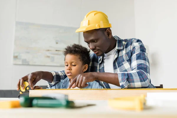 African-american father and son doing renovation — Stock Photo