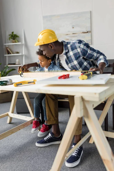 African-american father and son doing renovation — Stock Photo