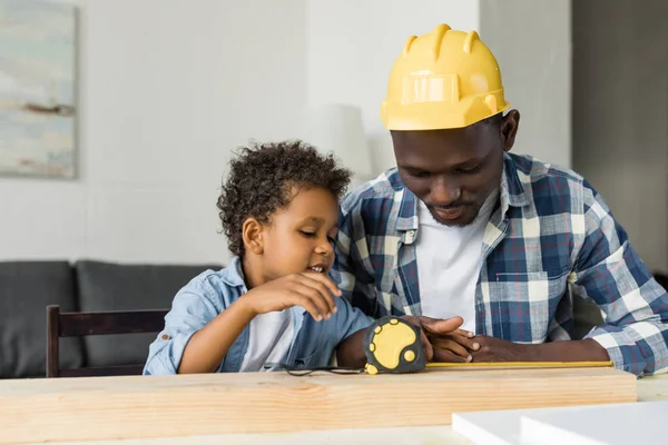 African-american father and son doing renovation — Stock Photo