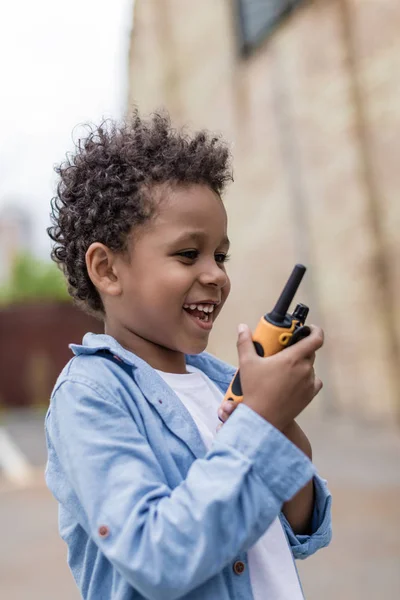 Cute boy with portable radio set — Stock Photo