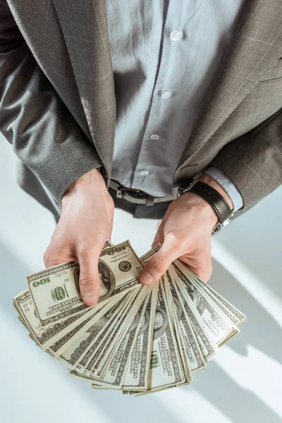 Close-up view of businessman holding money in hands — Stock Photo