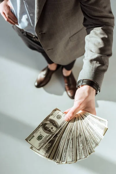 Close-up view of businessman holding money in hand — Stock Photo