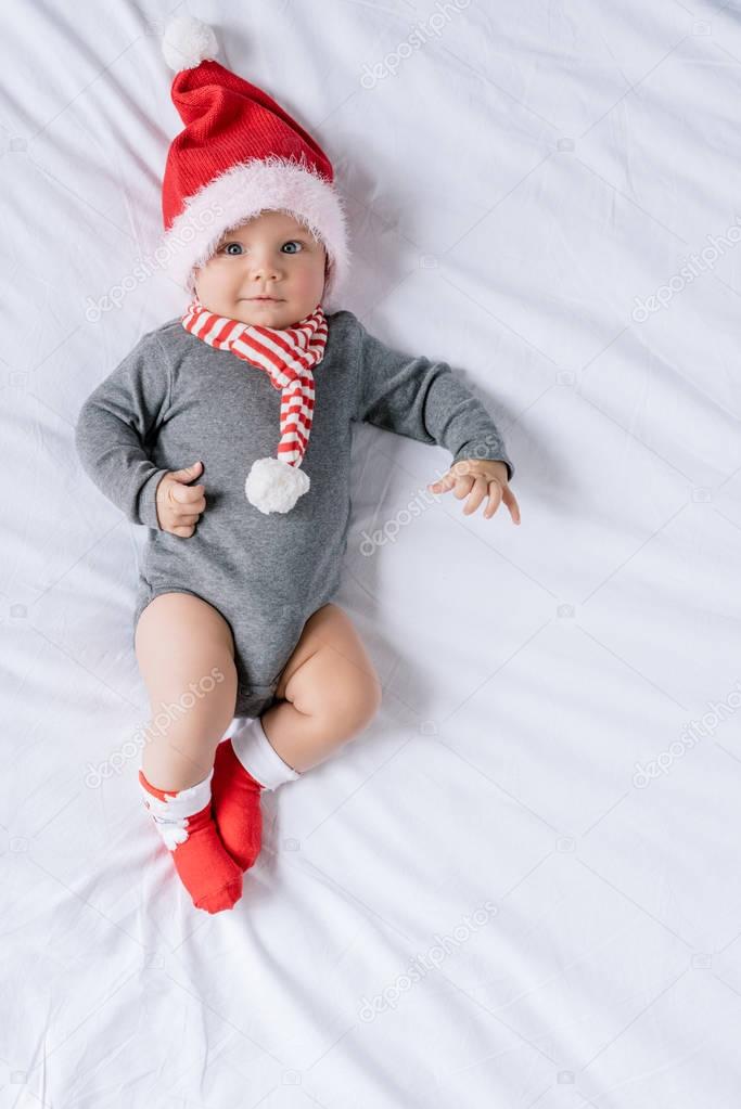 infant boy in santa claus hat