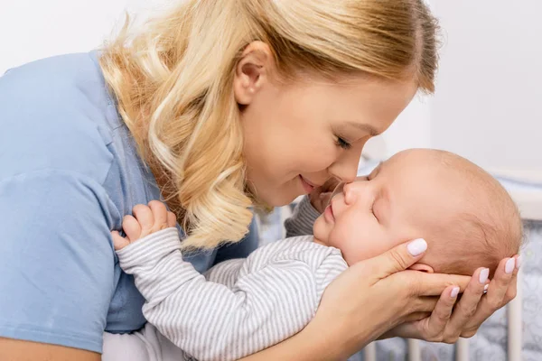 Sensual mother holding son — Stock Photo, Image