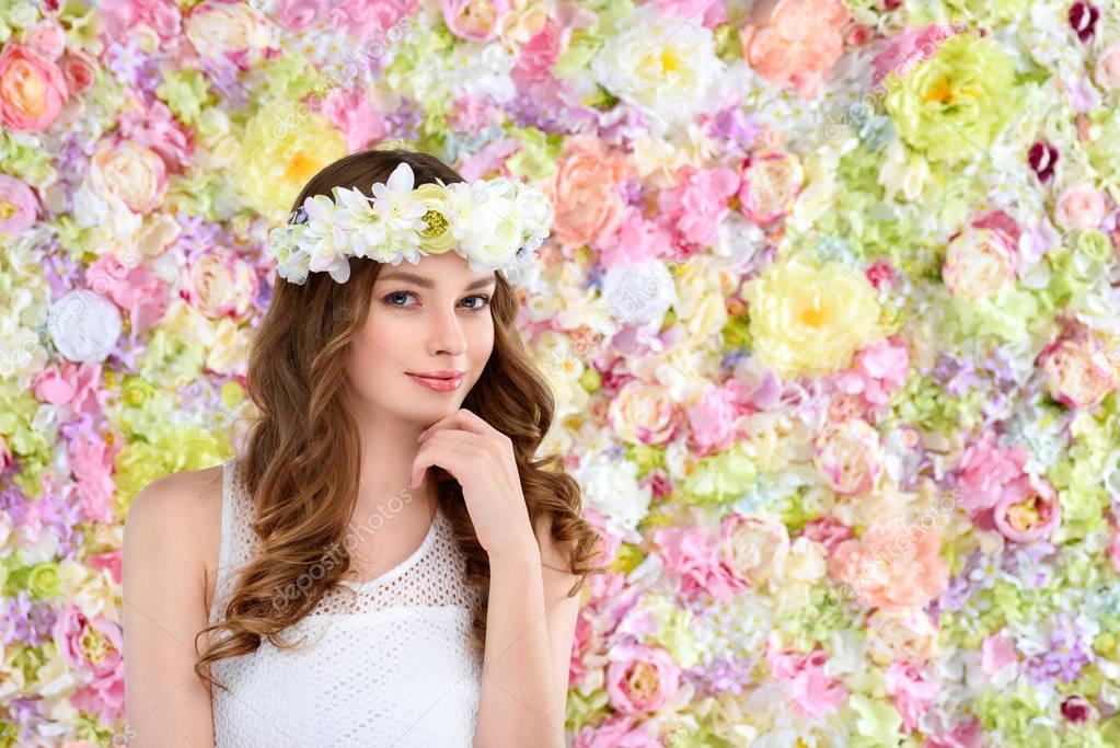attractive young woman in floral wreath