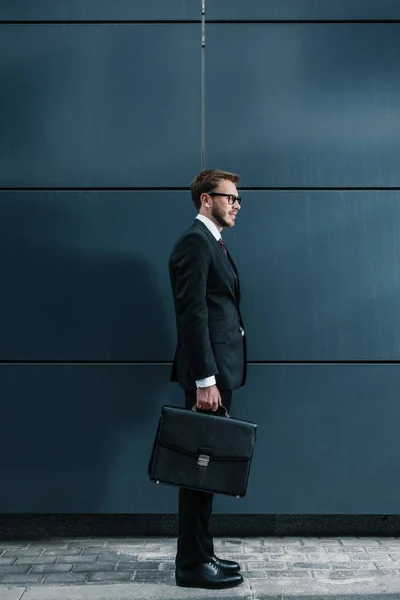 Stylish businessman with briefcase — Stock Photo