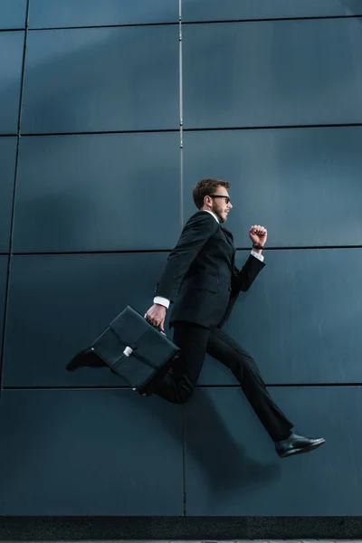 Stylish businessman with briefcase — Stock Photo