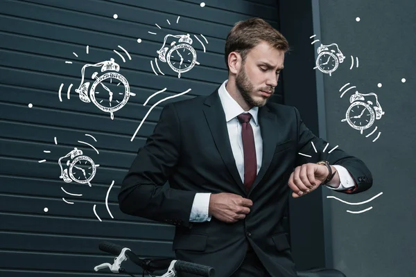 Stylish businessman with bicycle — Stock Photo