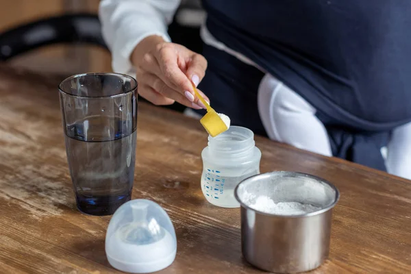 Mother preparing kids food — Stock Photo