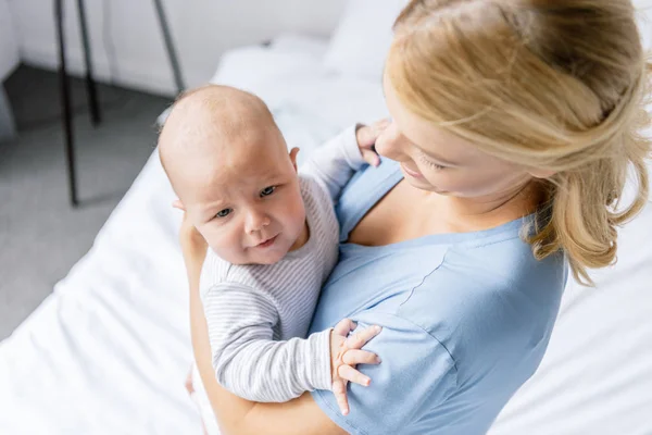 Mother holding infant — Stock Photo