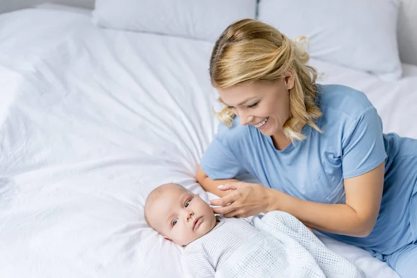Mother looking at infant son — Stock Photo