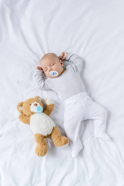 Baby sleeping with toy — Stock Photo