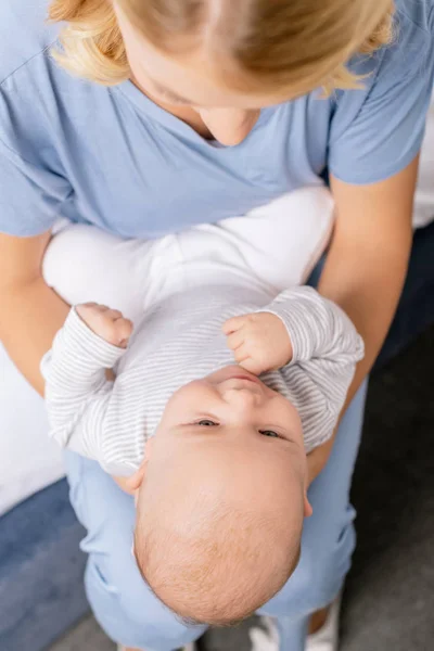 Baby on mothers hands — Stock Photo