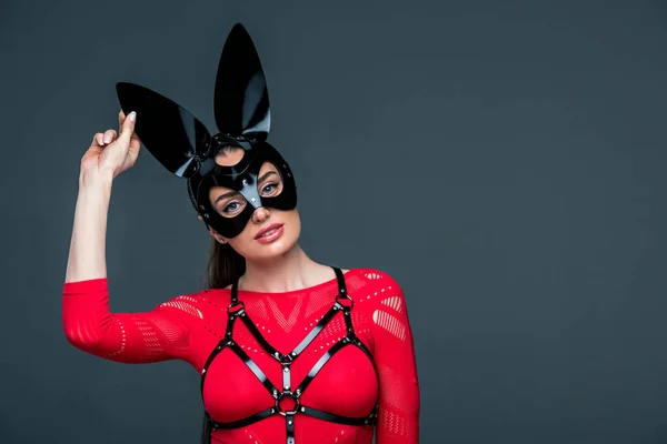 Seductive young woman in bunny mask isolated on grey — Stock Photo