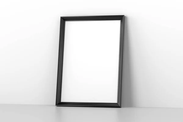 Blank wooden picture frame leaning on white wall — Stock Photo, Image