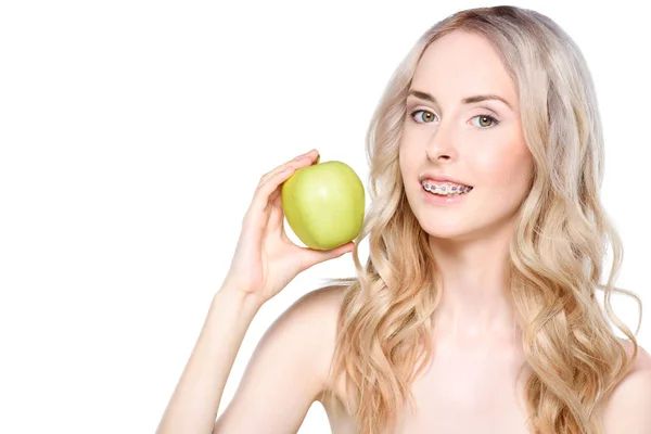 Woman holding apple in hand — Stock Photo, Image