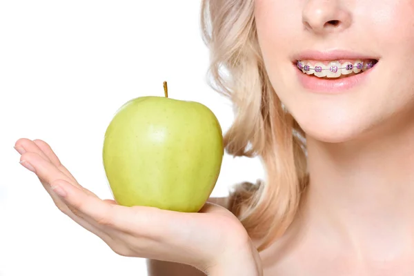 Woman holding apple on hand — Stock Photo, Image