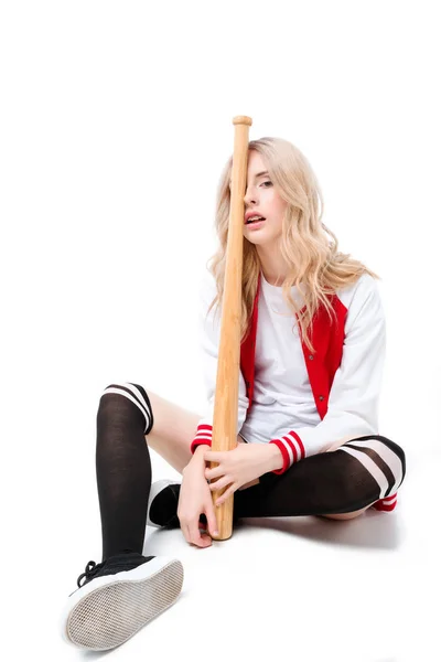 Woman sitting and holding baseball bat — Stock Photo, Image