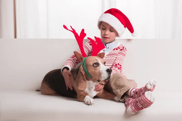 Boy and his dog on christmas — Stock Photo, Image