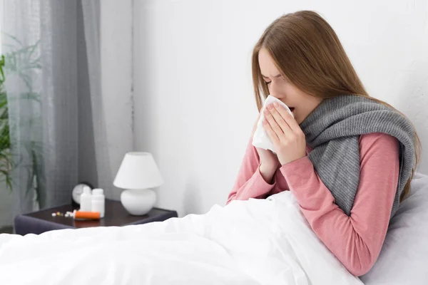 Sick girl wiping nose — Stock Photo, Image