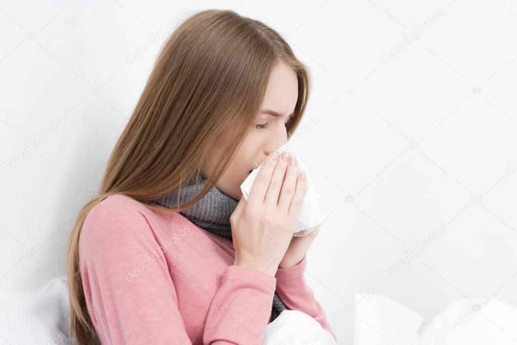 girl wiping nose
