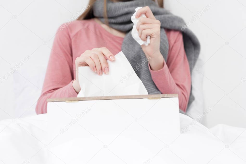 sick girl with napkins