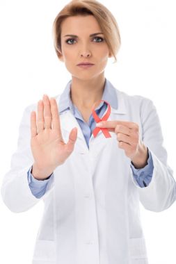 doctor with aids ribbon showing stop clipart