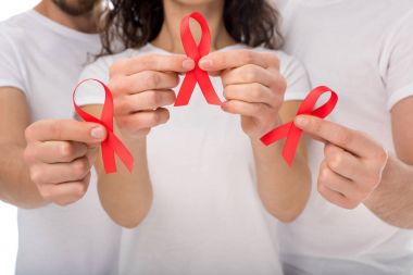 people with aids ribbons in hands clipart