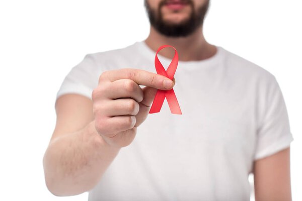 man holding aids ribbon