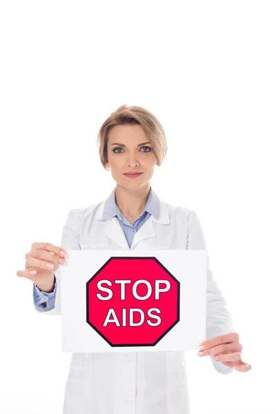 Doctor with stop aids placard — Free Stock Photo