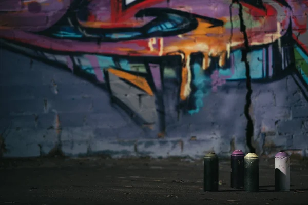 Colorful Graffiti Wall Cans Aerosol Paint Standing Foreground — Stock Photo, Image