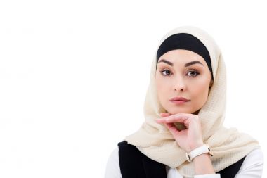 portrait of attractive arabic businesswoman in hijab looking at camera isolated on white clipart