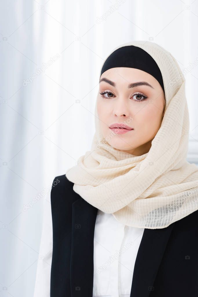 portrait of beautiful businesswoman in hijab looking at camera