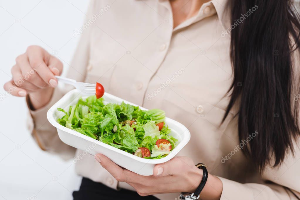 partial view of businesswoman with take away food in office