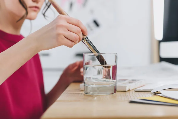 Cropped View Female Illustrator Cleaning Brush Glass — Stock Photo, Image